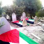 في قرية تل _ قضاء نابلس تزيين قبور الشهداء بعلم فلسطين