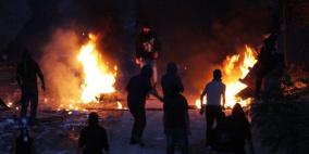 الاحتلال يتسبب باشتعال النيران بمنزل ويعتقل فتى في مخيم عايدة