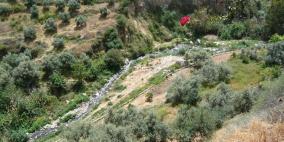 فتح وادي فصايل بعد انسداده بسبب تجمع الحجارة