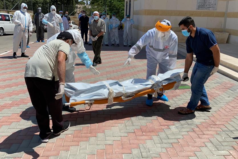 جثمان متوفى بكورونا في الخليل