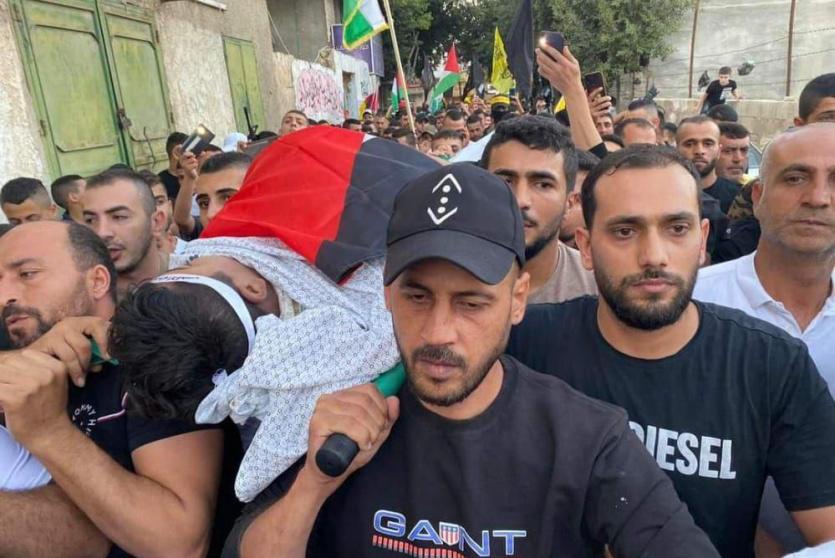 من تشييع جثمان الشهيد اليوم