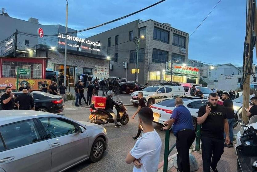 من مكان جريمة إطلاق النار في أم الفحم