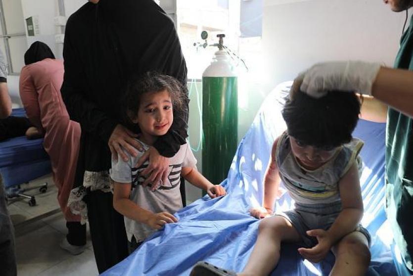 أطفال مصابين جراء القصف على غزة - ارشيف